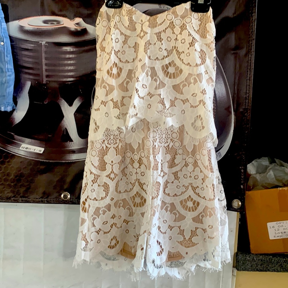 Strapless short jumpsuit!it’s off white. Leather or tan sandals would look great